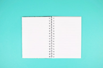 Notebook isolated on turquoise background