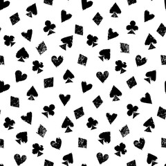 Playing cards different suits - hearts, diamonds, spades and clubs - black and white grunge seamless pattern, vector