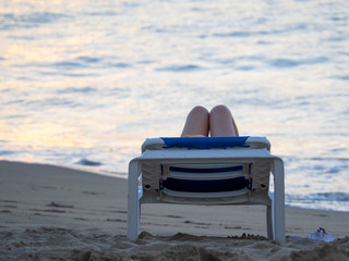 Fototapeta premium girl lying on a lounger, legs.