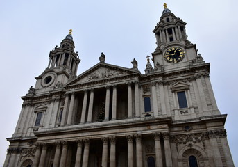 Fototapeta na wymiar St Pauls Cathedral. Facade closeup with towers, clock and columns. London, United Kingdom.
