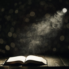 a book against a moonlight night city