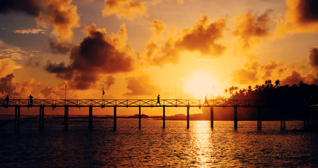 Fototapeta na wymiar pontoon with sunset on pacific ocean, philippines