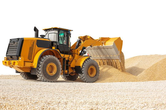 Working bulldozer on a building site isolated with clipping path. Modern wheel loader.