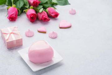 Romantic breakfast concept with heart shaped mousse cake.