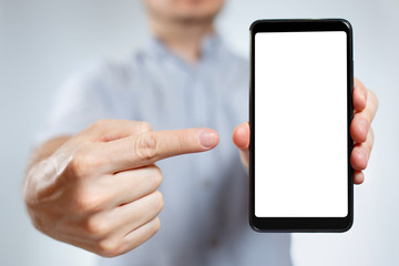 Man holding a smartphone and pointing at its screen