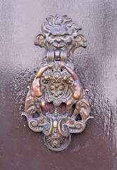 Italy,  Ravenna, very old downtown building door handle.