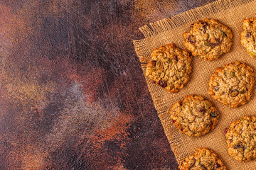 Obraz na płótnie Canvas Homemade oatmeal cookies with cranberries and pumpkin seeds.