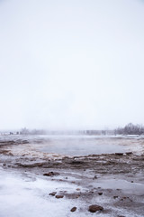 Tourists Visiting Steaming Geothermal Pools In Iceland