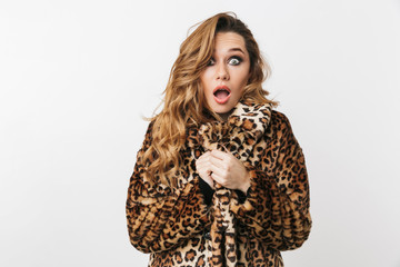Beautiful young woman wearing leopard coat