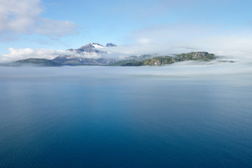 Fototapeta na wymiar Lake And Mountains In Alaska Covered In Mist