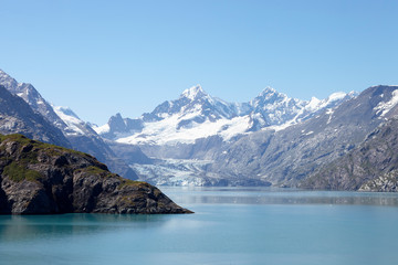Naklejka na ściany i meble Glacier Flowing Into Lake In Alaska USA