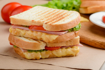 Sandwich with tomato, herbs, ham
