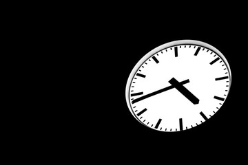 Public illuminated analog round clock against dark night