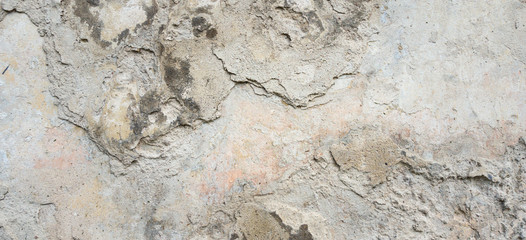 Old Wall With Peel Grey Stucco Texture. Retro Vintage Worn Wall Background. Decayed Cracked Rough Abstract Banner Surface.