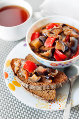 Vegetable ste with eggplant, red pepper and tomatoes on toasted rye bread