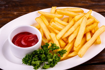 French fries with ketchup and parsley