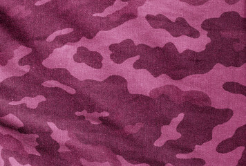 Old camouflage cloth in pink tone.