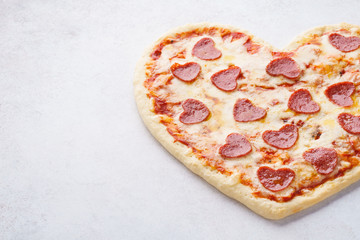 Heart shaped pizza with pepperoni for Valentines day.