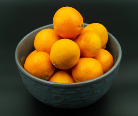 Mandarin Oranges in Bowl, black background