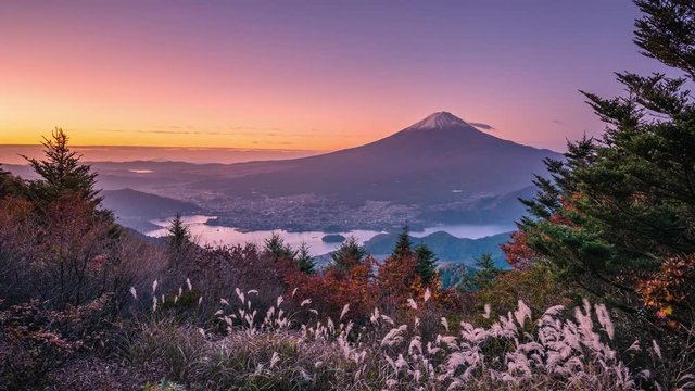 Mt. Fuji over Lake Kawaguchiko with autumn foliage at sunrise in Fujikawaguchiko, Japan.