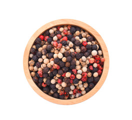 Mixed of peppers hot, red, black, white in wood bowl on white background.