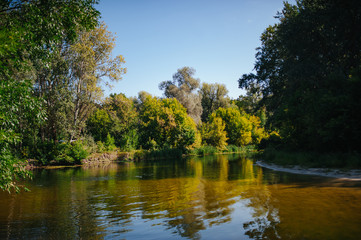 Safety life. Sunny day a calm river in summer. Beauty wild nature landscape. Ecology concept. Environmental protection. Water without pollution. Reserve of nature. Wild planet