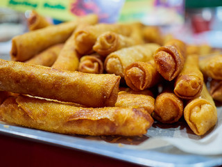 Street food. Spring rolls with filling