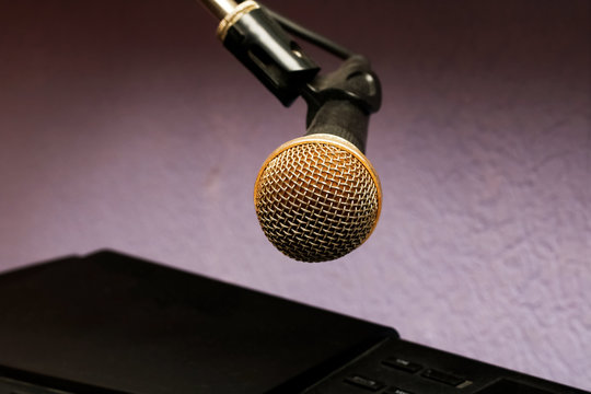 Microphone on a purple background close up