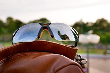 The Main Buddha statue reflection on a pilgrim's sunglasses at Buddhist monasteries or Buddha...