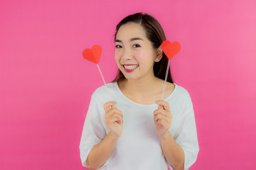 valentine day concept. Beautiful smiley asia girl with pink background copy space isolated.