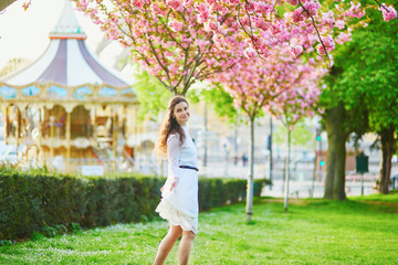 Woman enjoying cherry blossom season in Paris, France