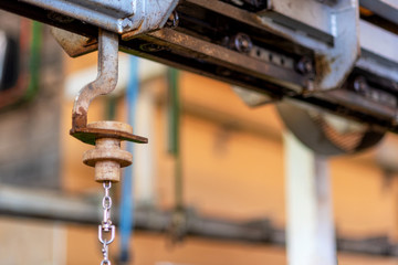 chain of crane in factory, industrial background .