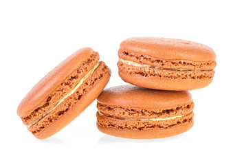 Delicious brown macaroons on a white background