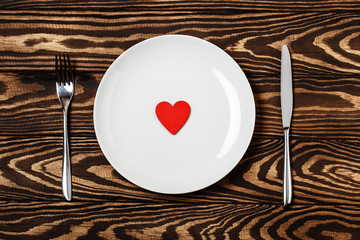 Dinner table. Love concept for mother's day and valentine's day. Valentine. Love. Valentine's Day postcard. Happy Valentine's day hearts on wooden background. Valentine card with space for text