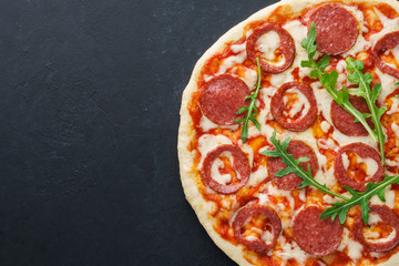 Half of pizza with heart shaped pepperoni for Valentine's Day.