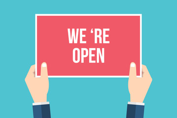 Hands holding placard with 