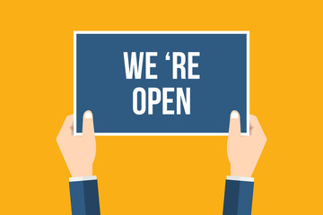 Hands holding placard with 