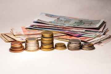 coins and calculator isolated on white