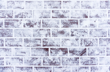 Frosted sidewalk in winter, cobble road with snow