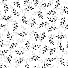 Illustration of sprigs arranged irregularly in shades of black and gray. Stylish repeating graphic pattern with plant silhouettes. Vector seamless pattern great for fabric. Surface repeat design.
