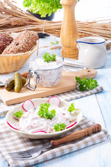 delicious homemade meat salad with mayonnaise and cucumber