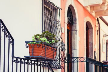 Travel to Italy -  historical street of Taormina, Sicily, balcony old buildings.