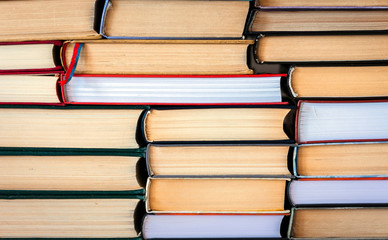 Stack of books education concept background, many books piles .