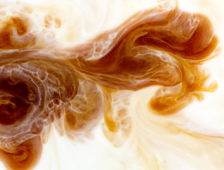 abstract background mixing coffee with milk flow