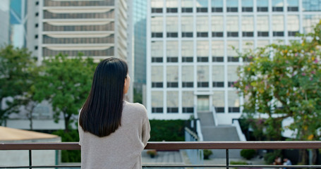 Woman look around in the city