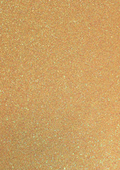 golden background with many glittery shimmering glitter in verti