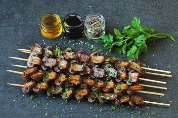 Skewers with mushrooms. balsamic grilled mushroom. Vegan mushroom skewers with parsley and garlic.