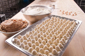 cooked meat dumplings on the wooden tabletop