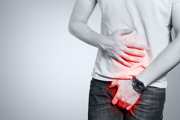 Man feeling a pain in his groin