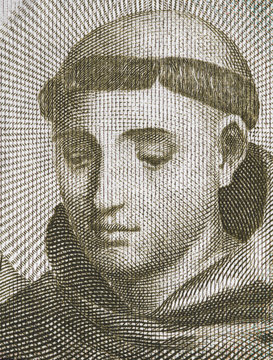 Saint Anthony of Padua portrait on old Portugal escudo close up macro. Franciscan friar, Roman Catholic priest and patron of the poor..